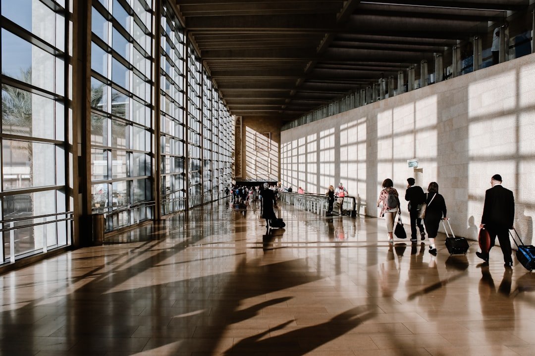 Traveler walking through an airport, representing portable oxygen concentrator use while traveling in Pakistan